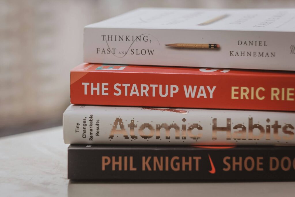 4 books on a table dedicated to personal development