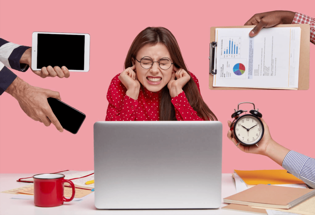 Woman getting distracted by external factors like notifications and gadgets